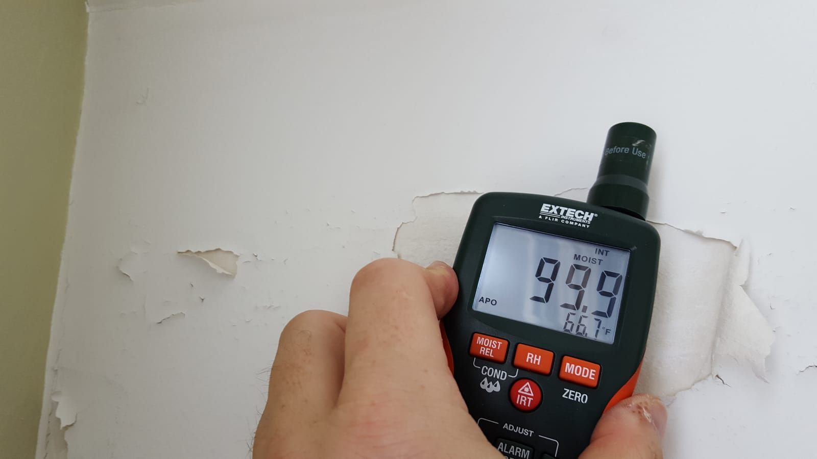 Moisture meter mapping ceiling and wall saturation
