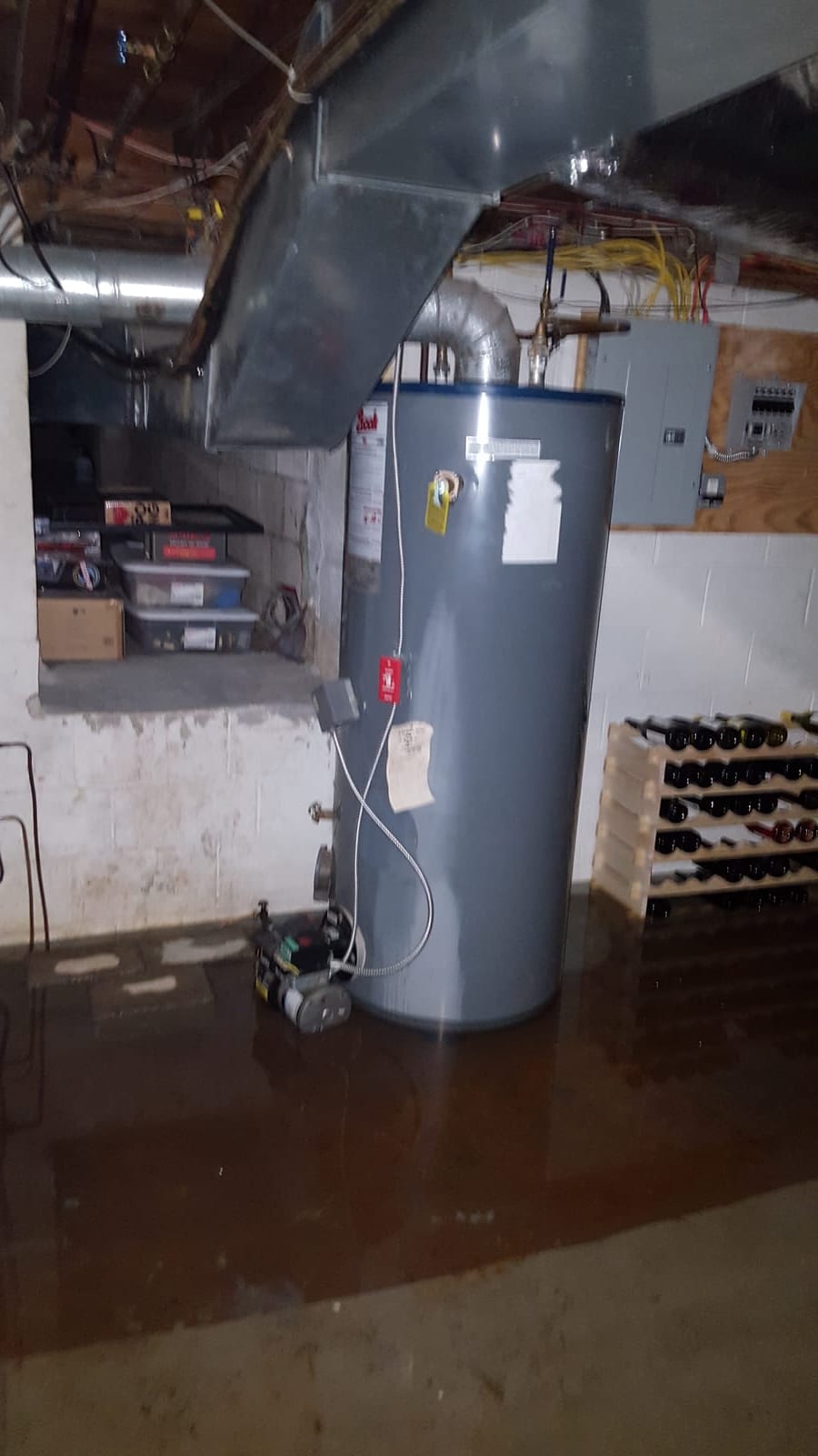 Water depth visible against finished basement walls